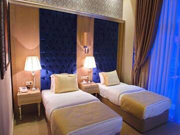 Фото номера Улучшенный двухместный номер с 1 кроватью Отель Qafqaz Tufandag Mountain Resort Hotel г. Габала 7