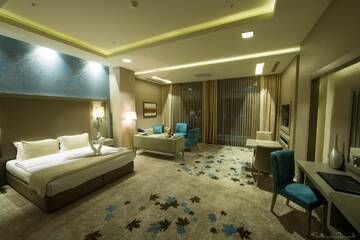Фото номера Семейный люкс Отель Qafqaz Tufandag Mountain Resort Hotel г. Габала 7